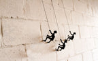 Set of Three Black Resin Climbing Man Hanging Dimensional Sculpture