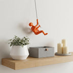 6" X 3" Orange Resin Climbing Man Hanging Dimensional Sculpture