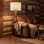 63" Brown And White Solid Wood Tripod Floor Lamp With White Linen Drum Shade
