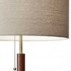 26" Antiqued Brass Solid Wood Table Lamp With Beige Drum Shade
