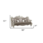 90" Gray Faux Leather Curved Sofa And Toss Pillows With Bone Legs