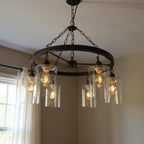 Black Shaded Six Light Metal and Transparent Glass Chandelier With Clear Shades