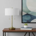 20" Antiqued Brass Metal Two Light Table Lamp With White Drum Shade
