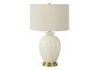 26" Gold and Ivory Ceramic Urn Table Lamp With Cream Drum Shade