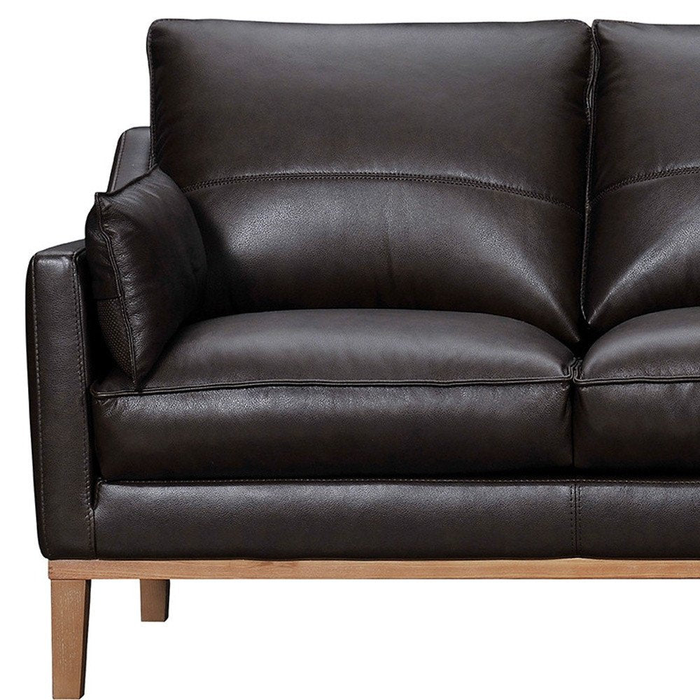 87" Gray Leather Sofa And Toss Pillows With Brown Legs