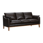 87" Gray Leather Sofa And Toss Pillows With Brown Legs