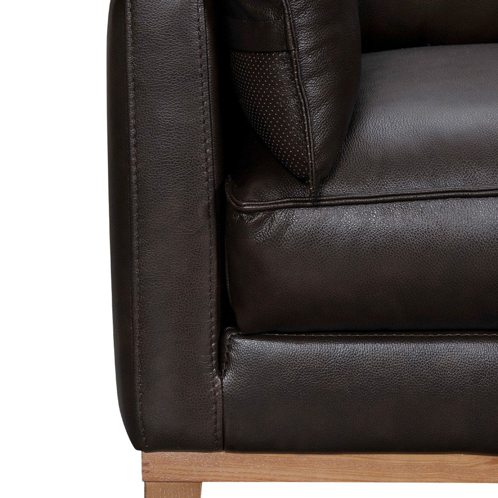 87" Gray Leather Sofa And Toss Pillows With Brown Legs