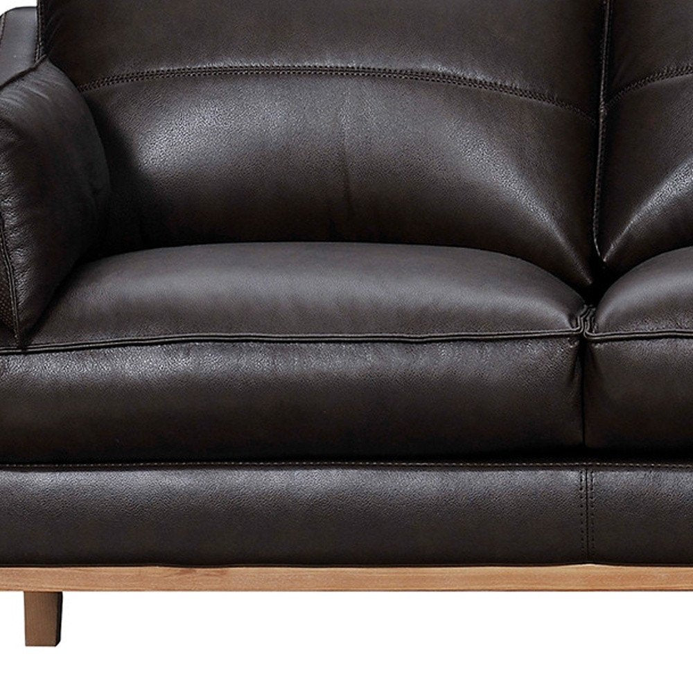 87" Gray Leather Sofa And Toss Pillows With Brown Legs
