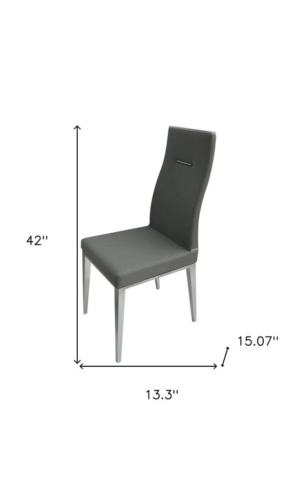 Set of Four Dark Gray And Silver Faux Leather And Wood Dining Side Chairs