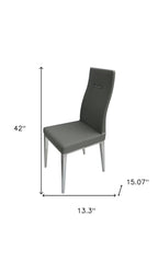 Set of Four Dark Gray And Silver Faux Leather And Wood Dining Side Chairs
