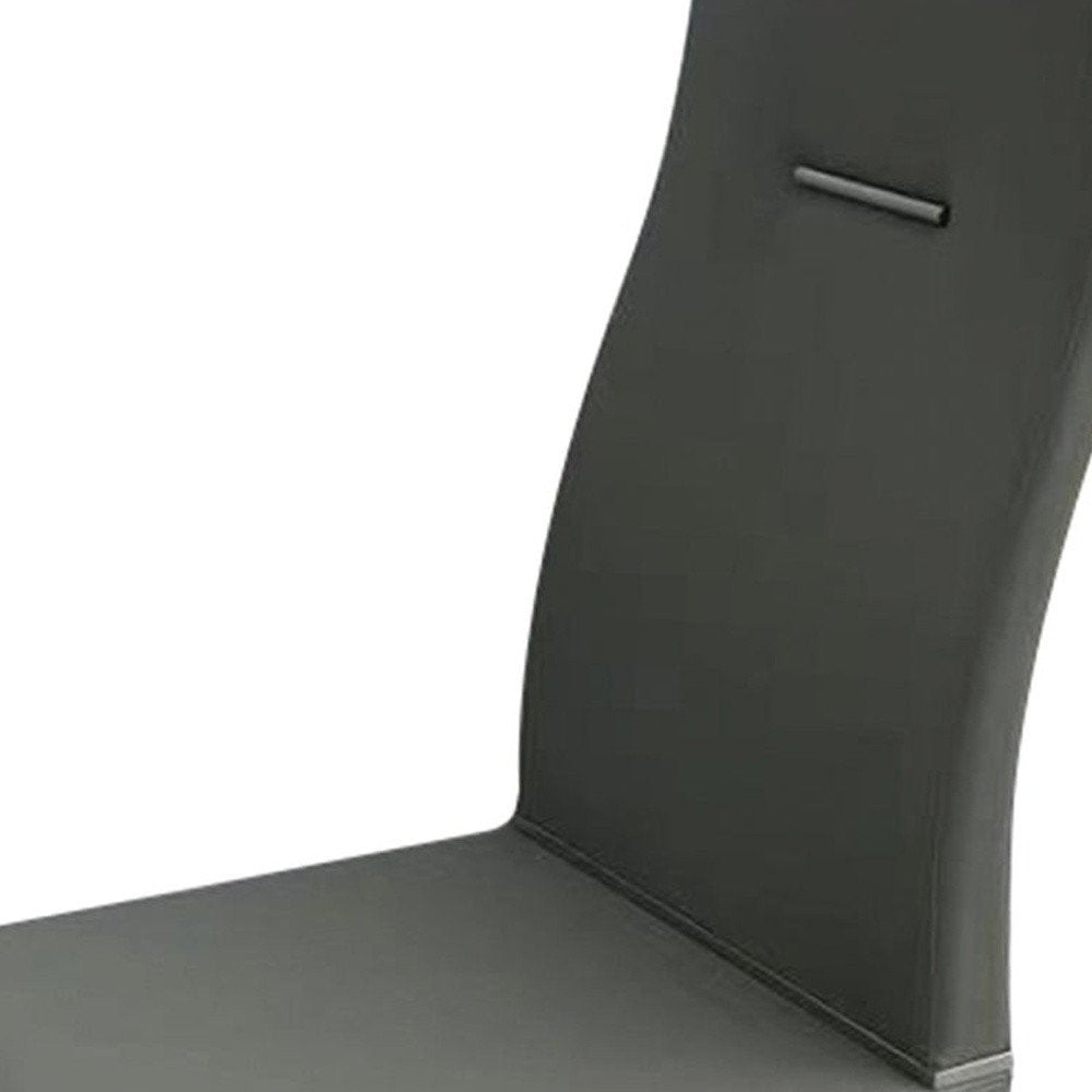 Set of Four Dark Gray And Silver Faux Leather And Wood Dining Side Chairs