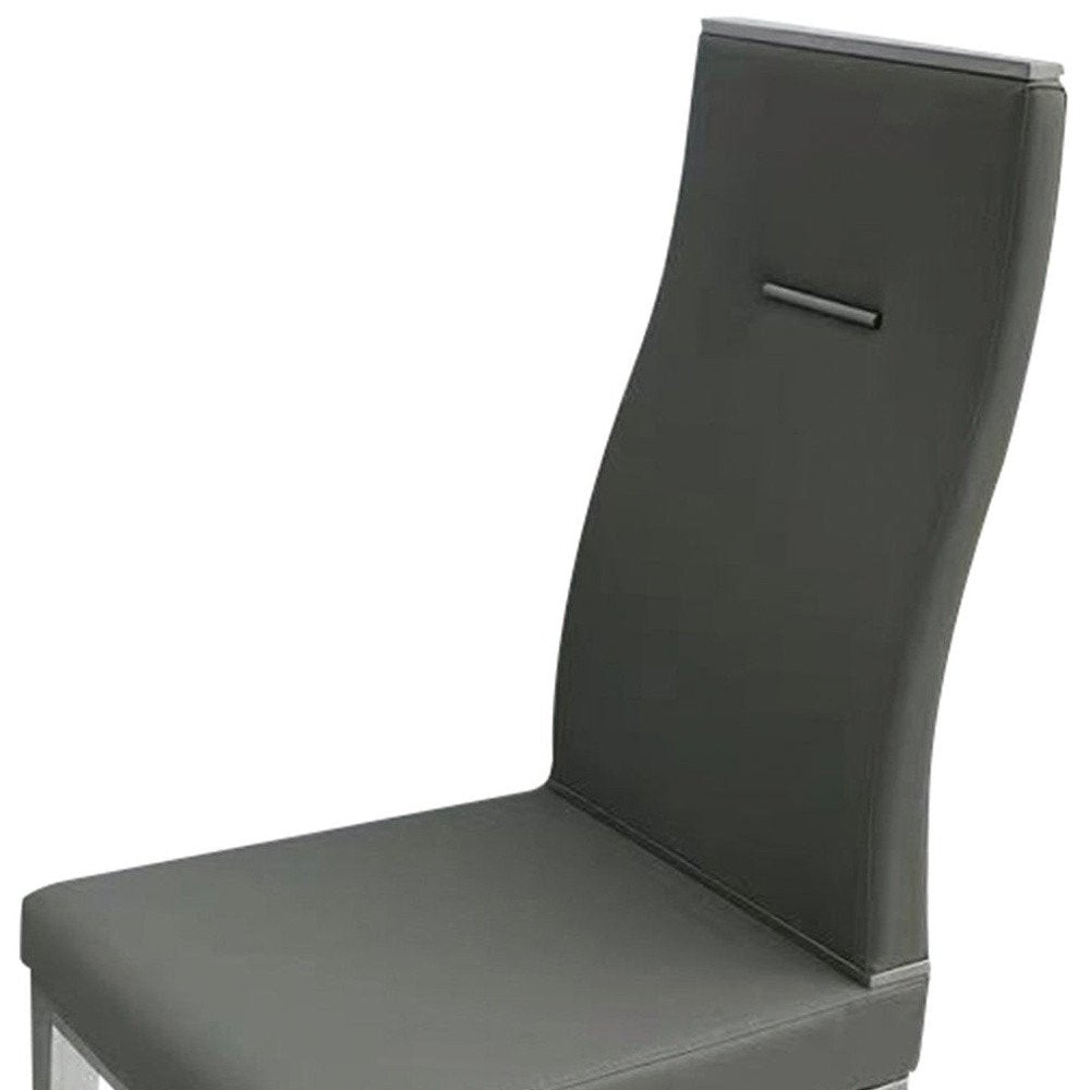 Set of Four Dark Gray And Silver Faux Leather And Wood Dining Side Chairs