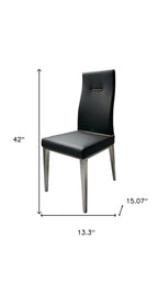 Set of Four Dark Gray And Silver Faux Leather And Wood Dining Side Chairs