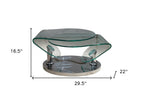 30" Clear And Silver Glass And Metal Oval Abstract Coffee Table