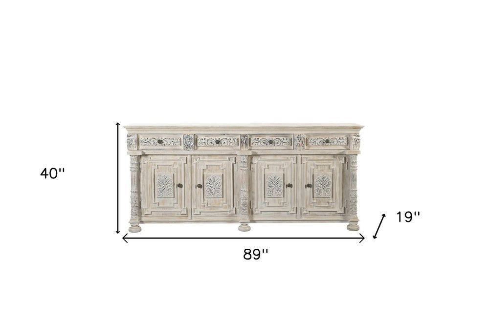 89" White Distressed Solid Wood Carved Scrollwork Four Drawer Sideboard With Four Doors