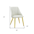 Set of Two White and Gold Upholstered Faux Leather And Metal Dining Side Chairs
