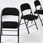 Set of Four Black Faux Leather and Steel Folding Chairs