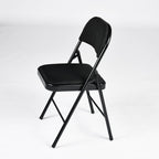 Set of Four Black Faux Leather and Steel Folding Chairs