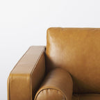 88" Tan Leather Sofa With Toss Pillows